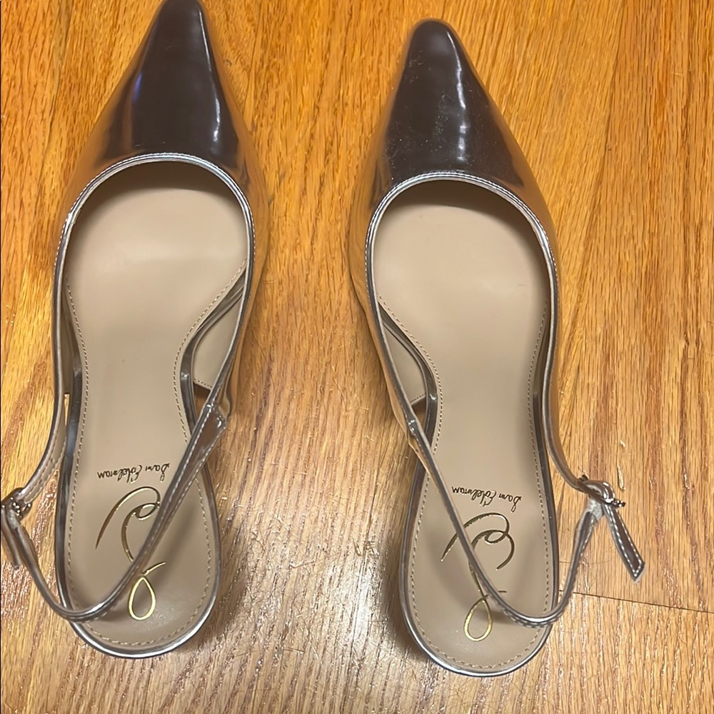 Brand New silver pumps with low heel! Great for upcoming holiday events!